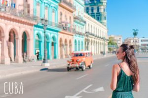 happy-woman-in-popular-area-in-old-havana-cuba